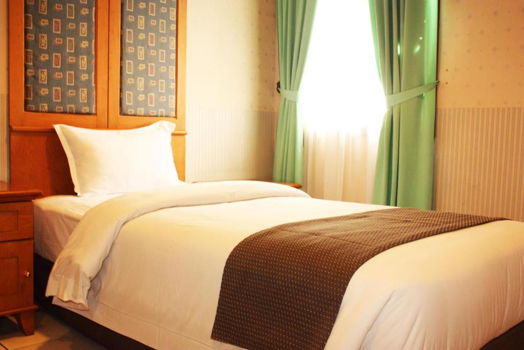 Travellers Suites Serviced Apartments Медан Номер фото